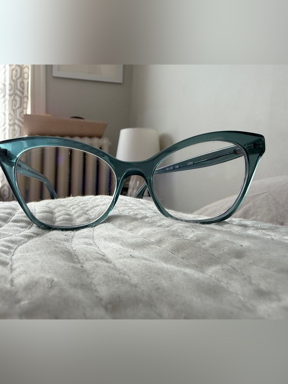 See light green cat-eye glasses